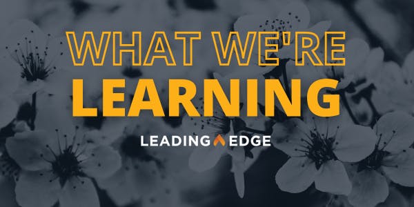 "What We're Learning" over a background of cherry blossoms, with the Leading Edge logo below.