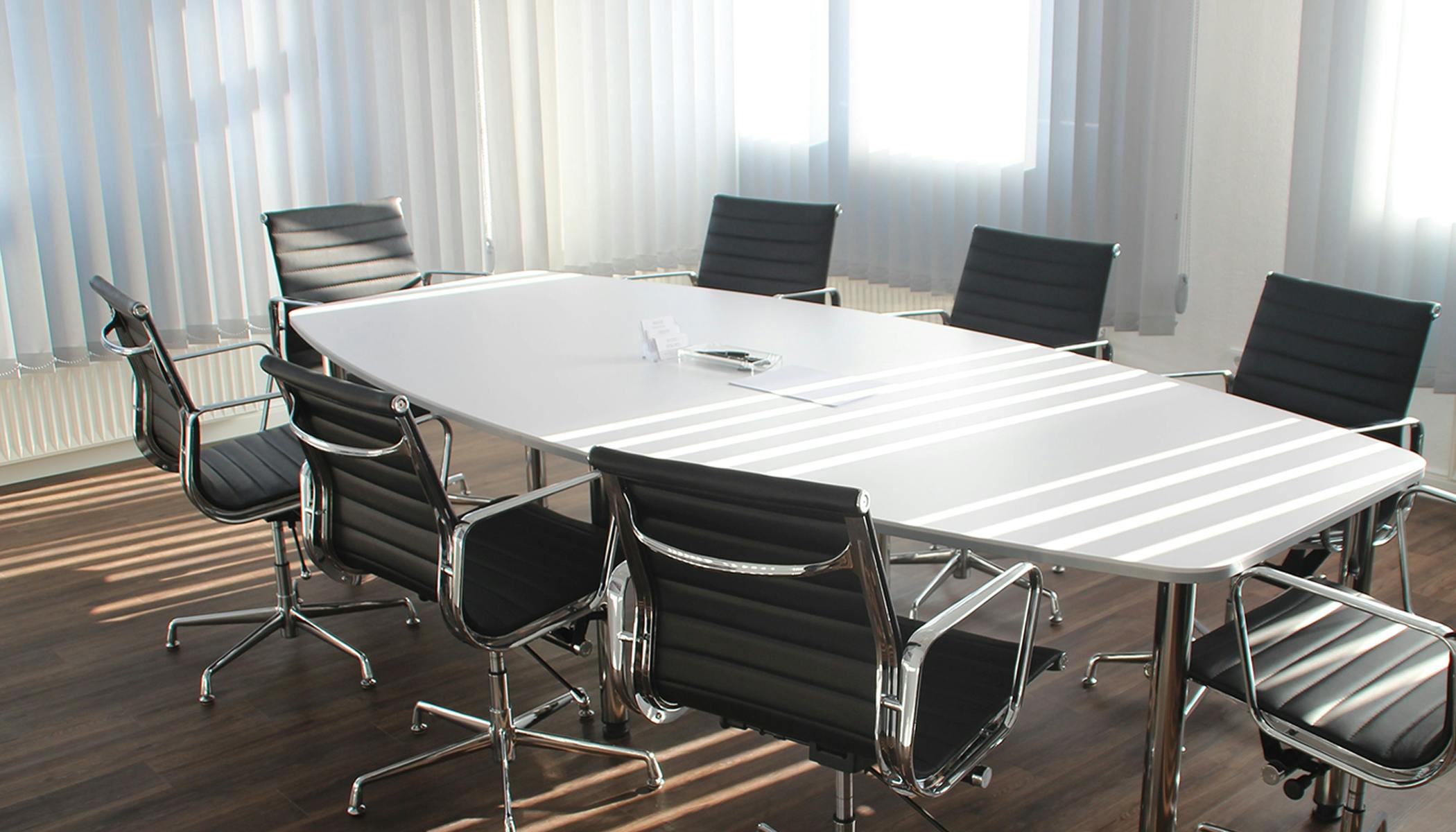 Photo of board room conference table and chairs