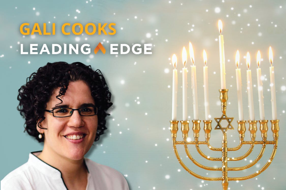 Gali Cooks, Leading Edge. On the right side is a gold menorah with eight lit candles and a central shamash, all flames glowing warmly.