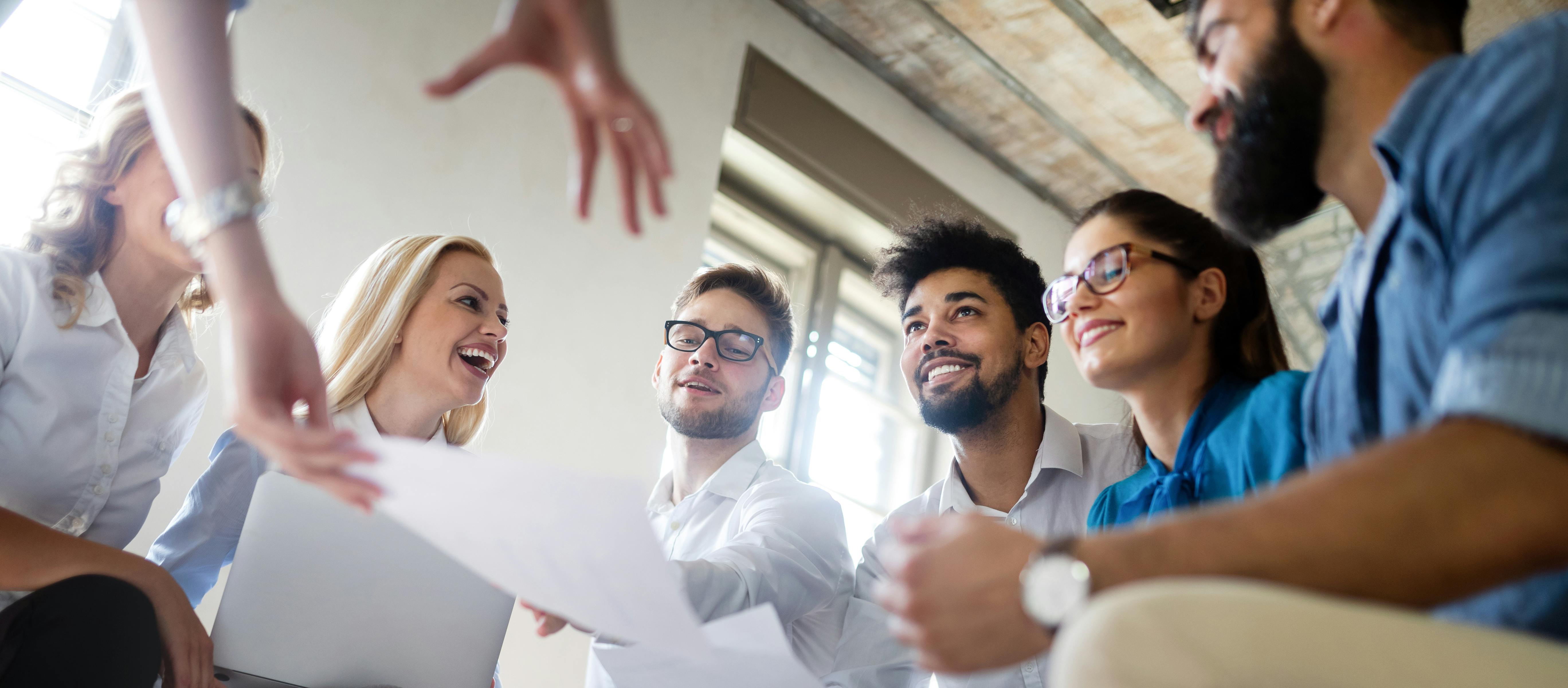 Smiling group of people during presentation.