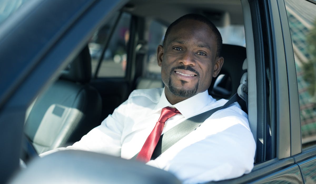 business man in business lease car