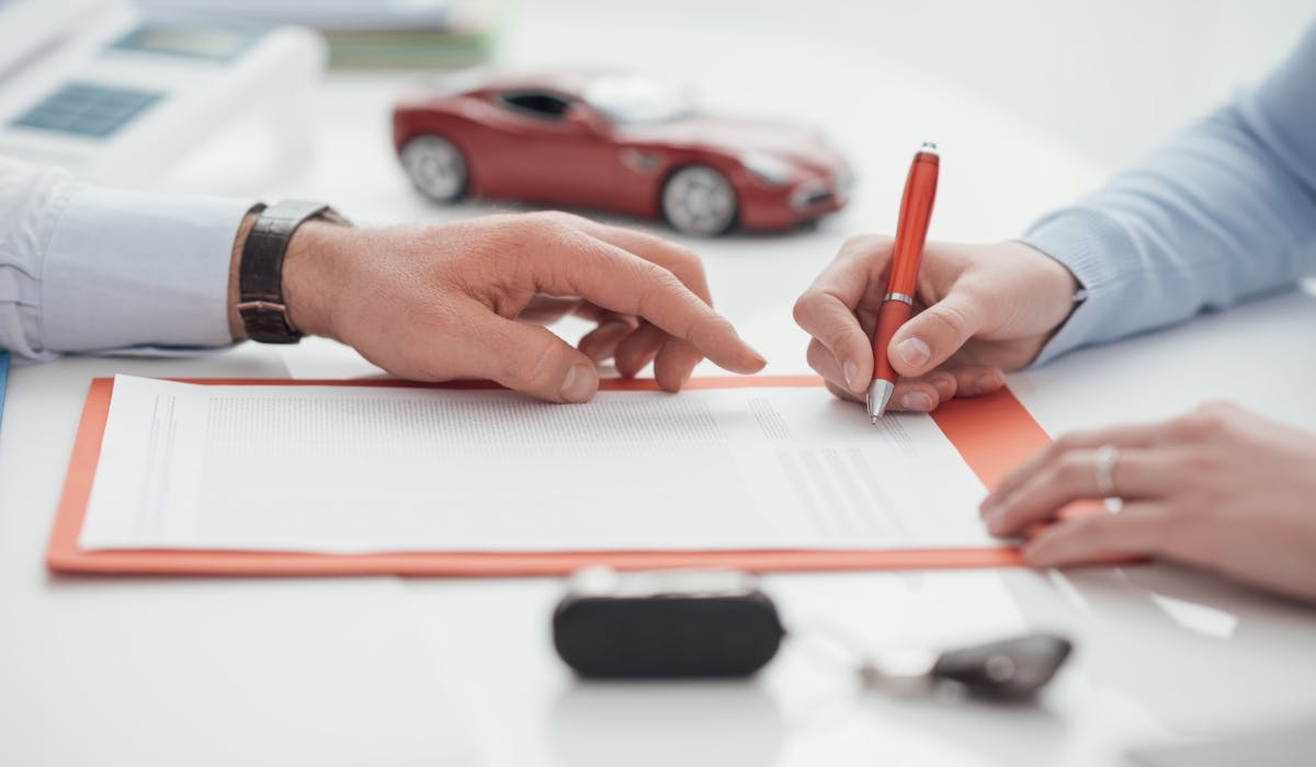 signing car insurance policy
