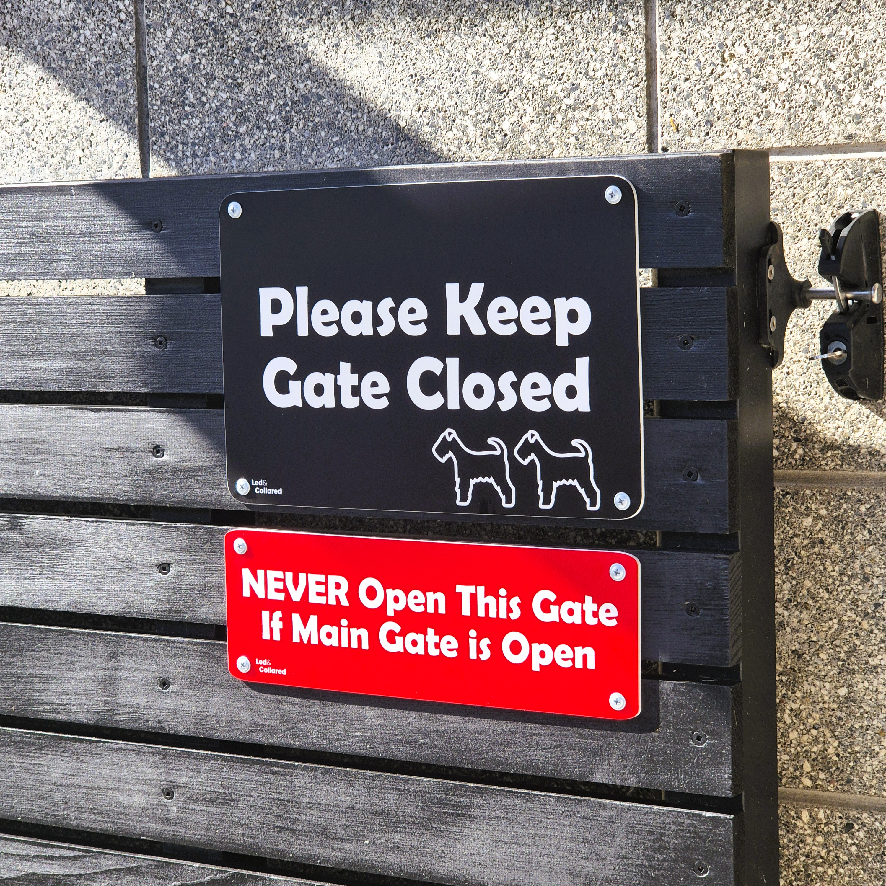 Custom Signs - black and white + red and white - on gate