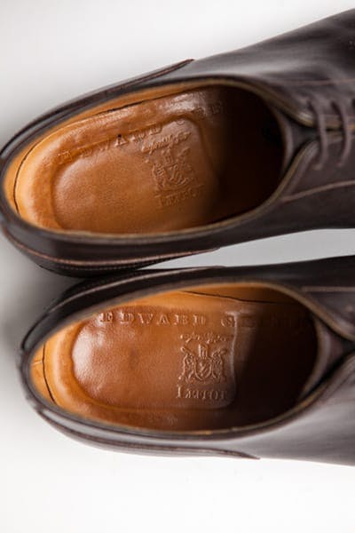A top-down view of the shoe’s interior, showing the wear on the heel.