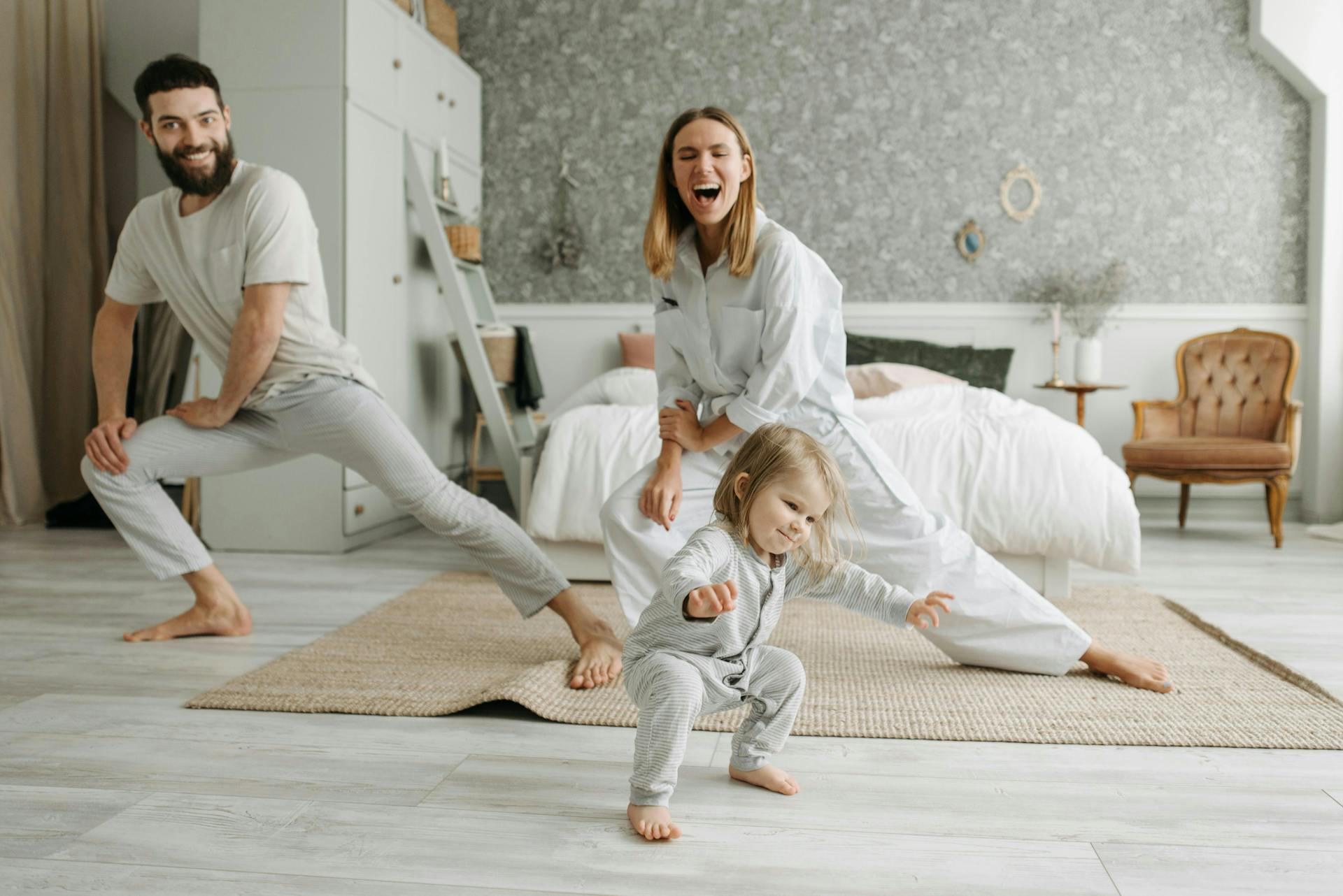 Parents dancing with their child.