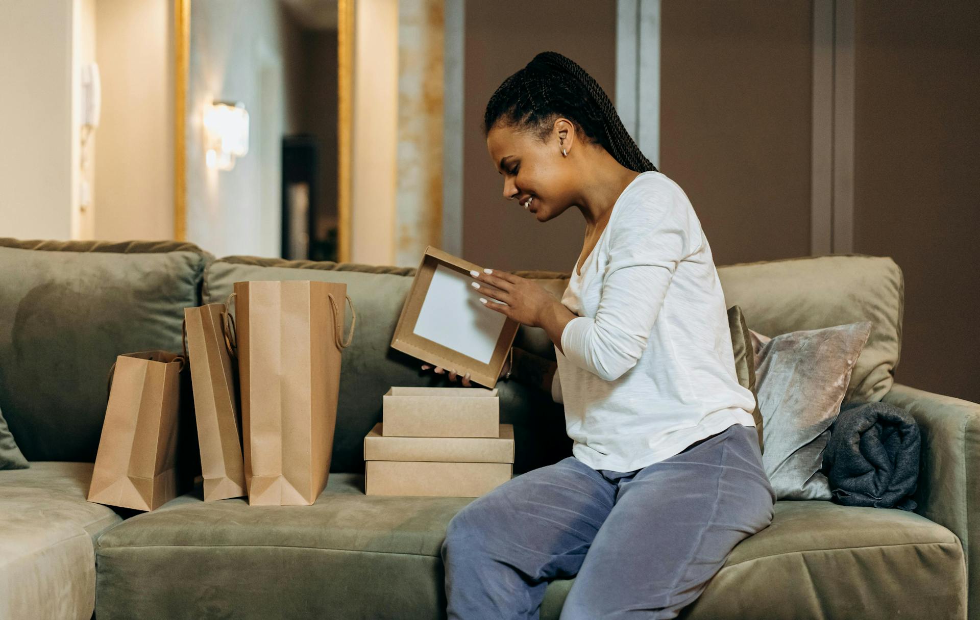 A woman opening boxes.