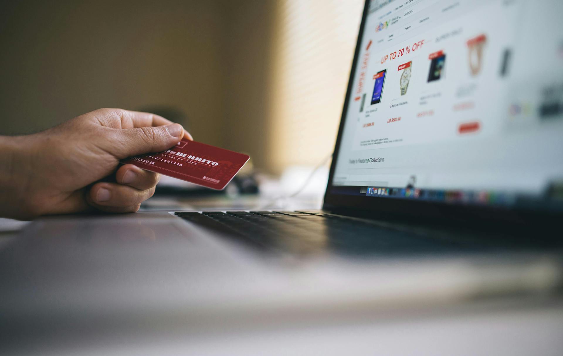 A person paying online with their credit card