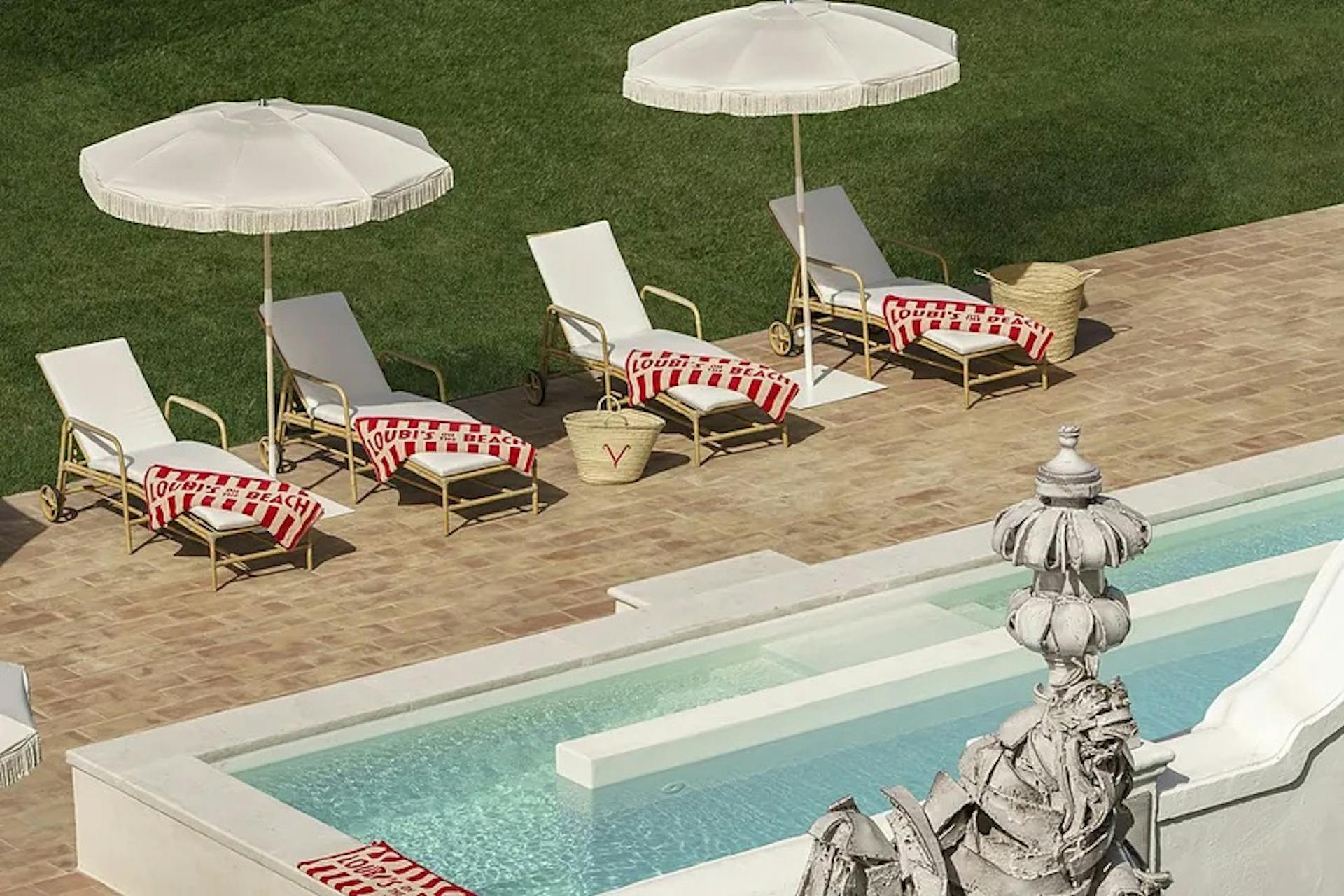 Poolside at Louboutin's Portugal hotel.