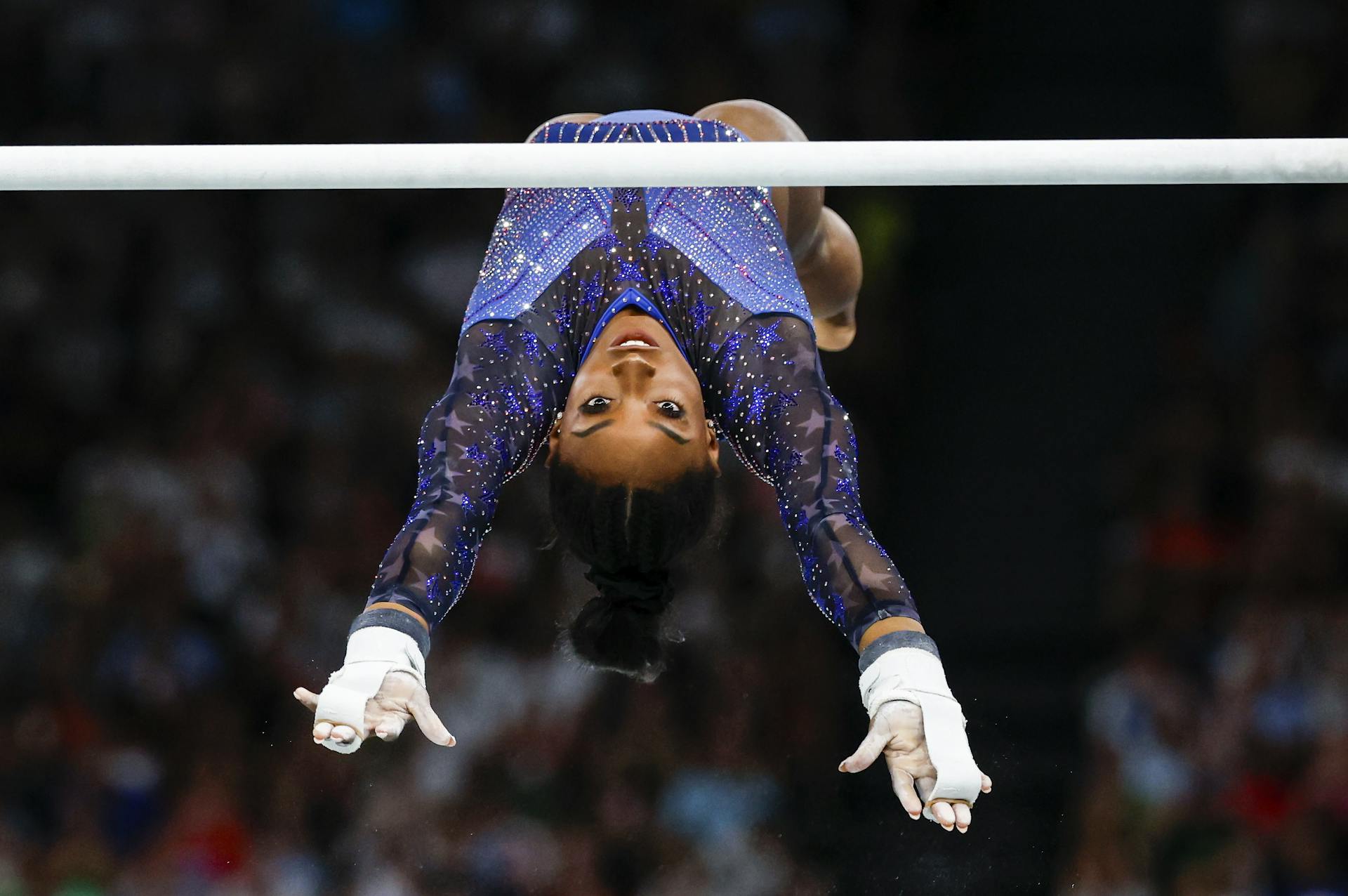 Simone Biles on the horizontal bars.