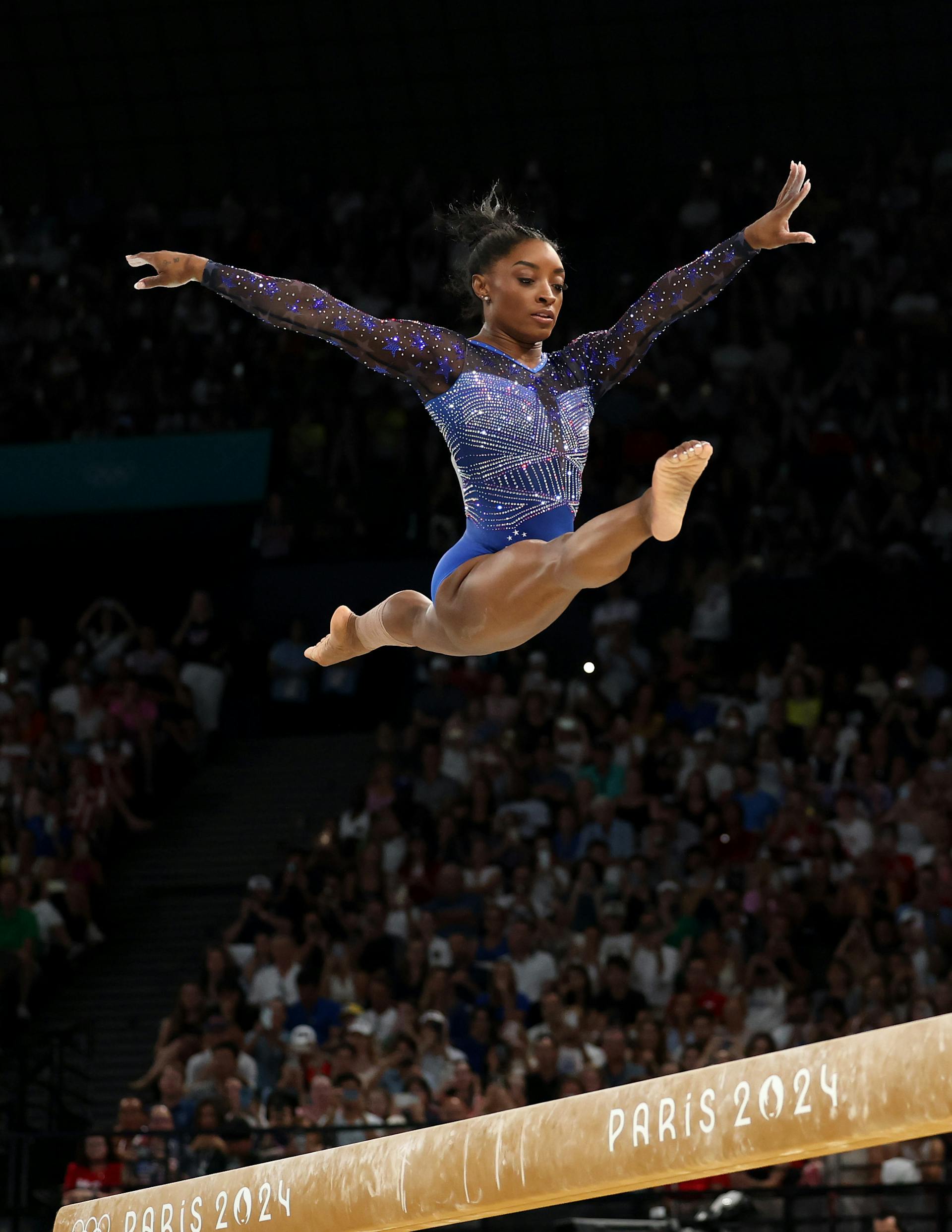 Simone Biles on the beam. 