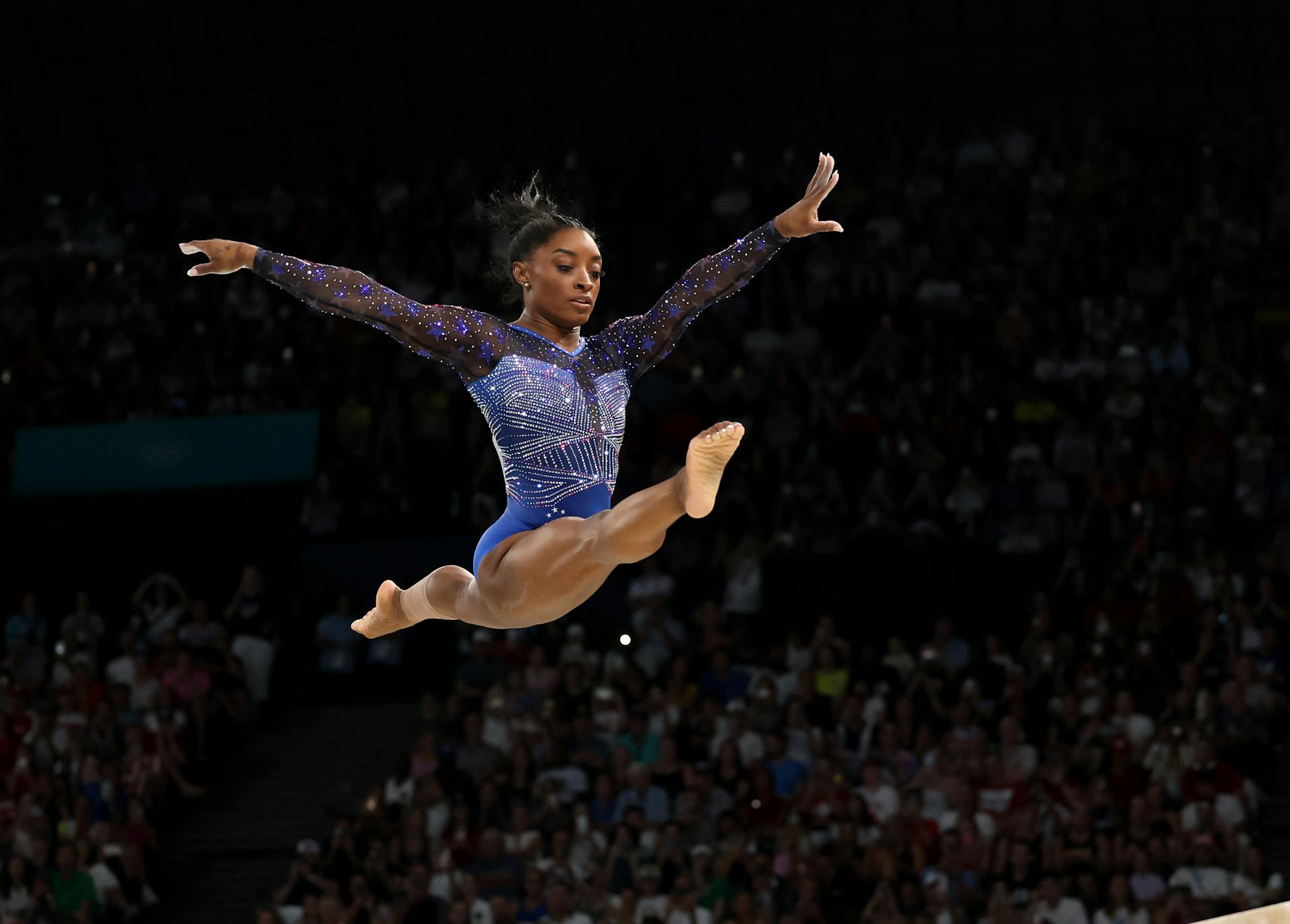 Simone Biles on the beam. 