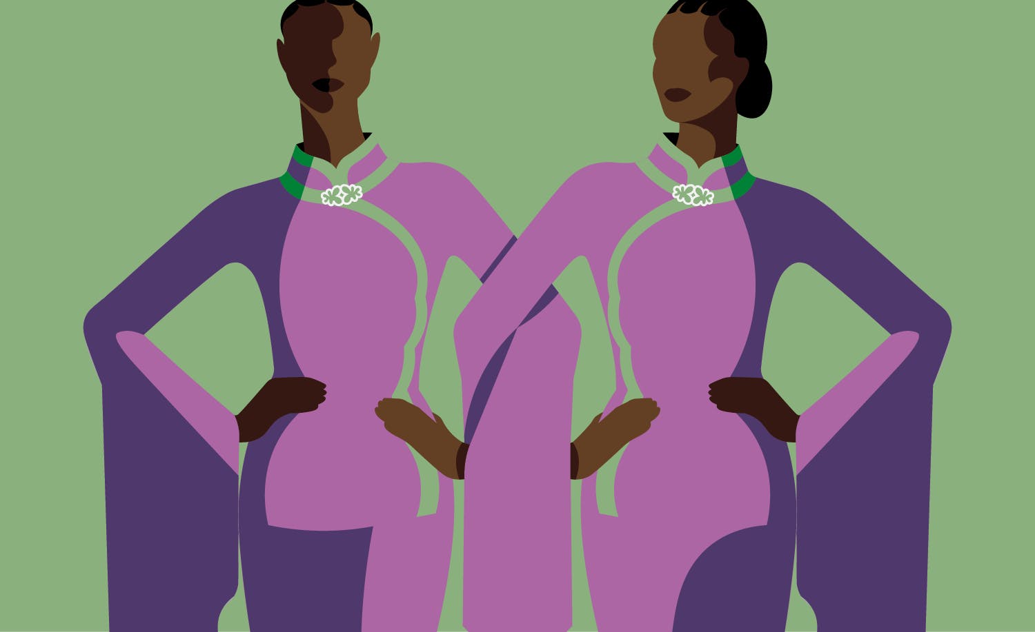 two women in purple dresses standing next to each other.