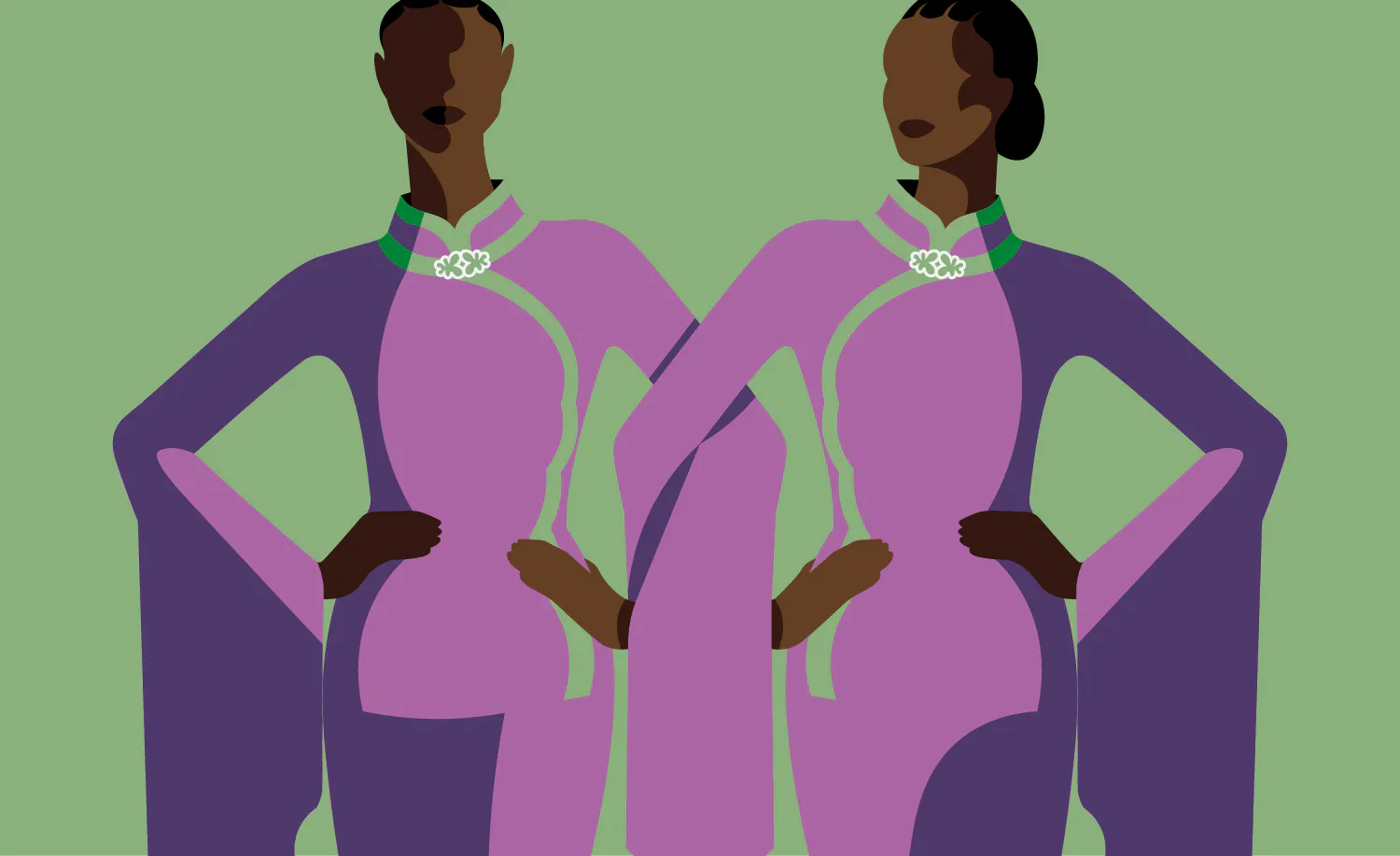 two women in purple dresses standing next to each other.