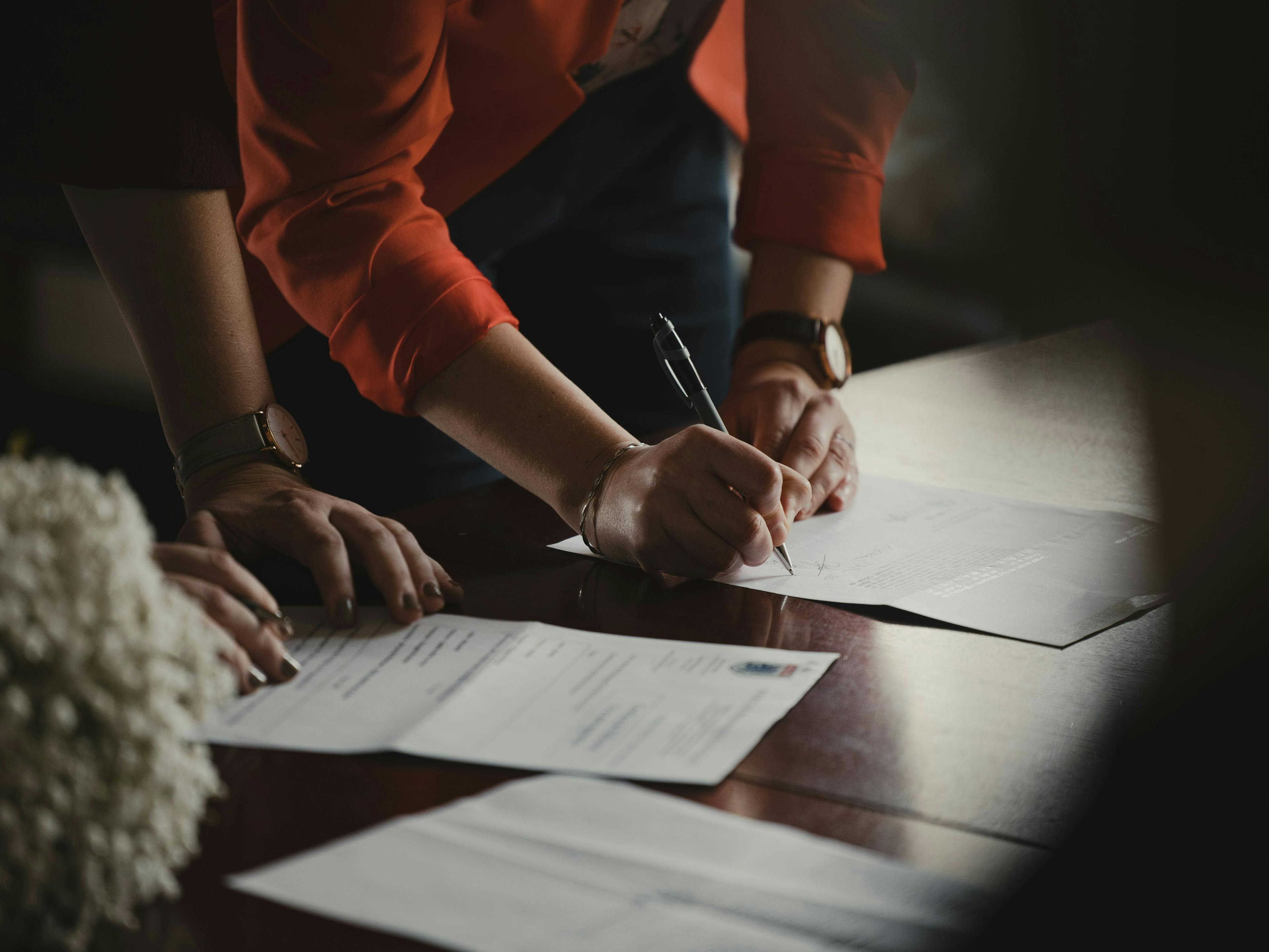 a person signing a document