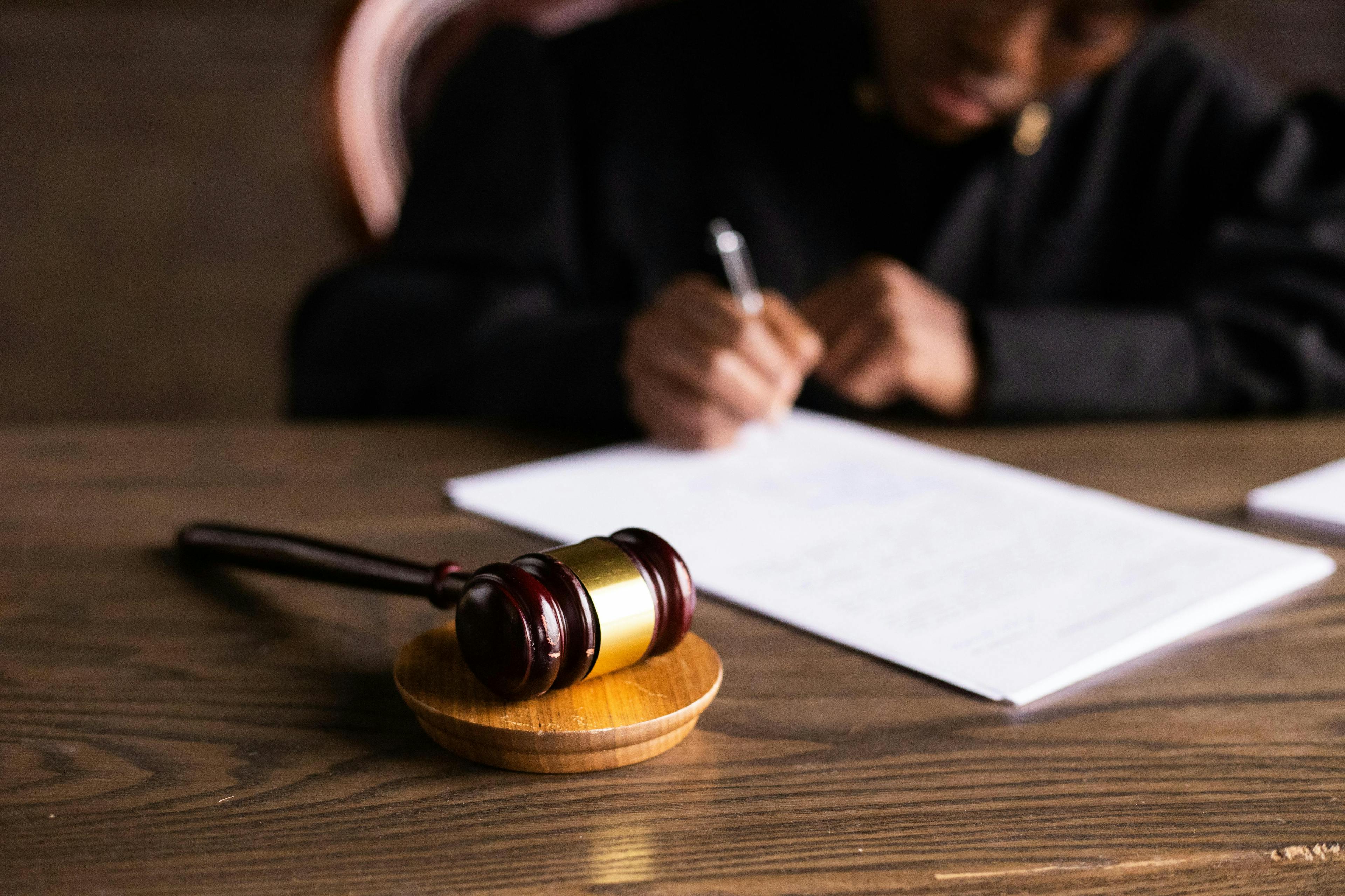 Judge preparing paperwork in court.