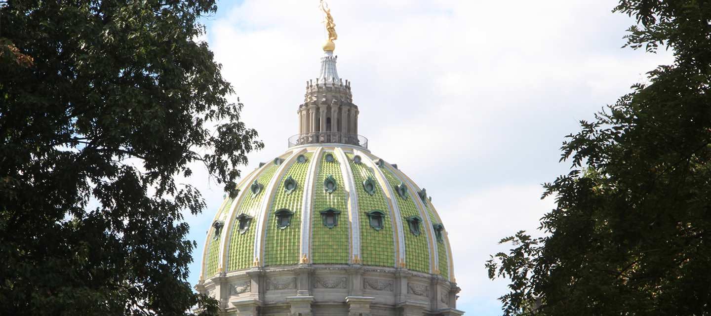 Pennsylvania capitol dome surrounded by trees