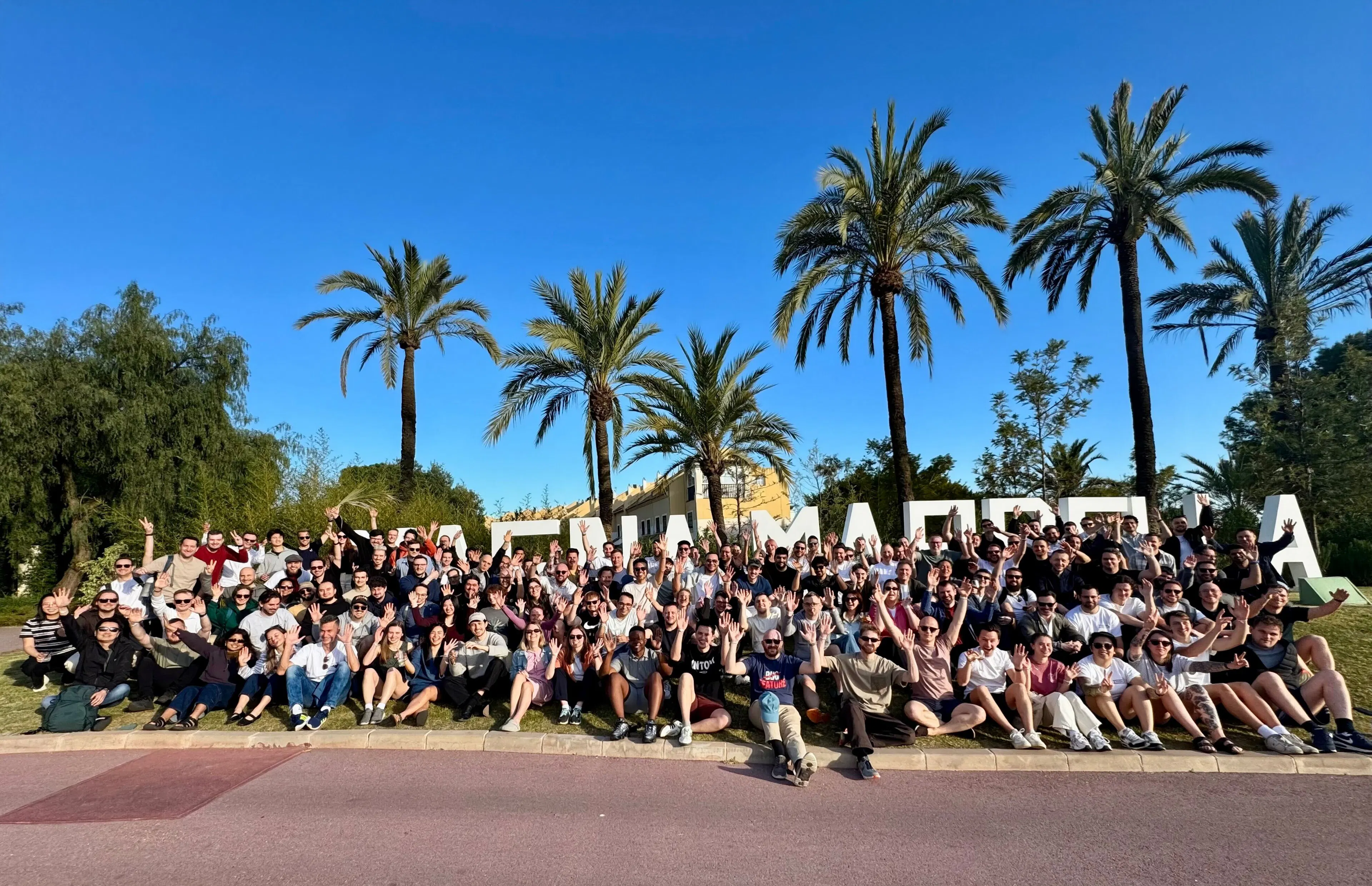 A group of people sat together at a team offsite.