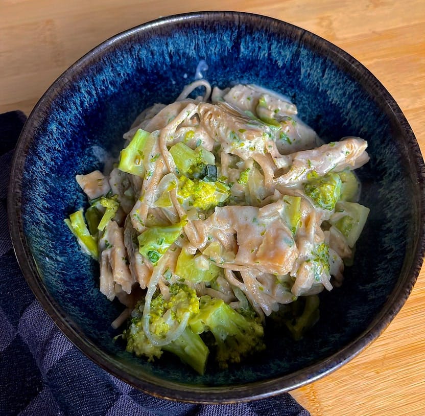 Whole wheat pasta with creamy broccoli sauce and vegan chicken