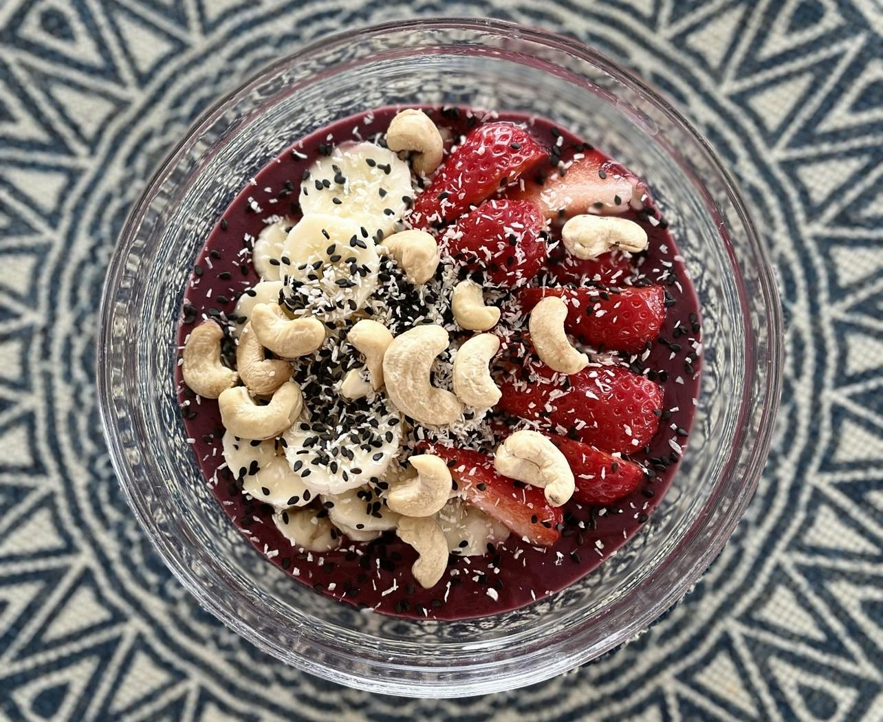 Açai and coconut smoothie bowl with banana, strawberries & cashews