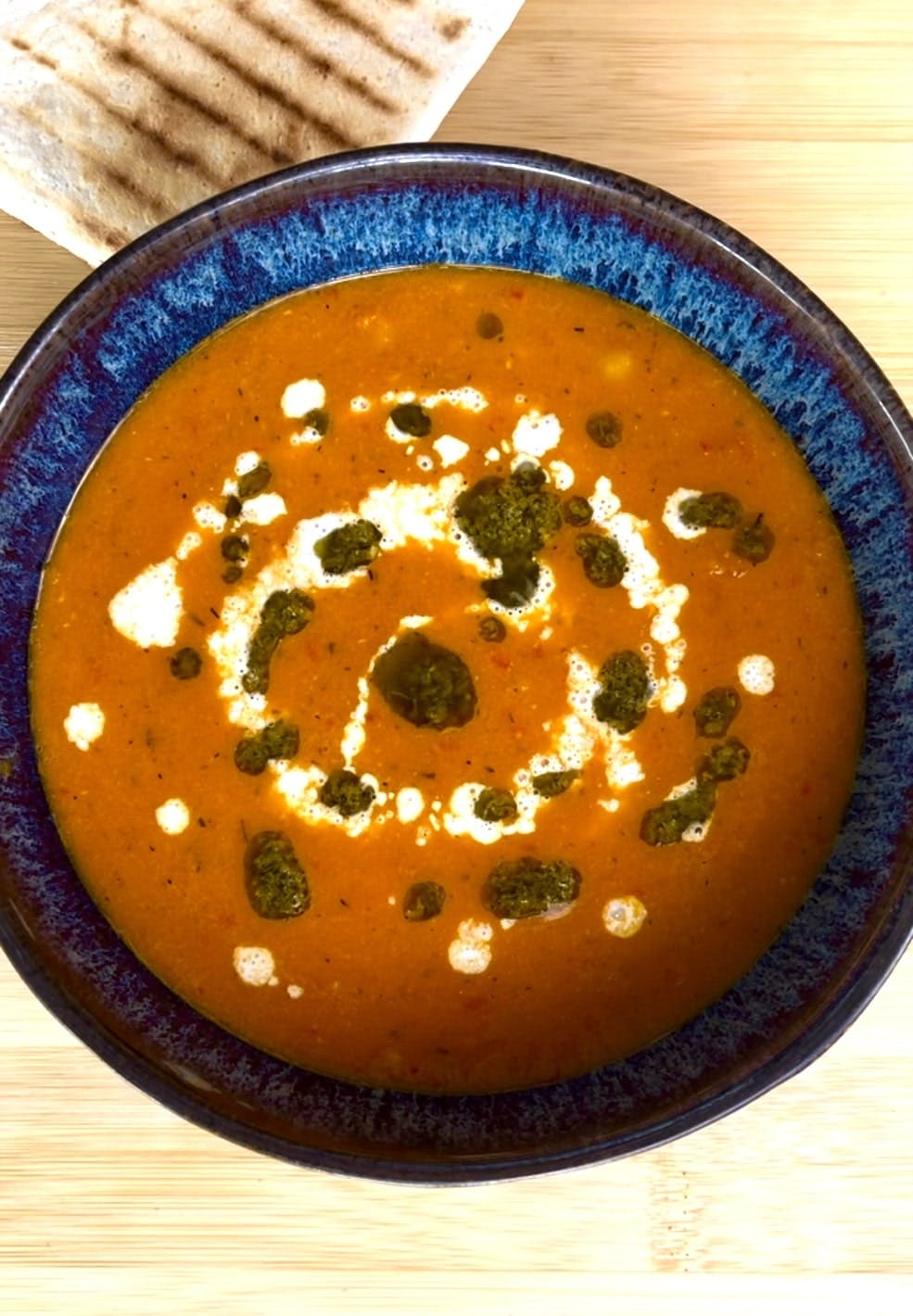 Creamy tomato soup with pesto oil