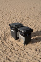 Two bins in the sand