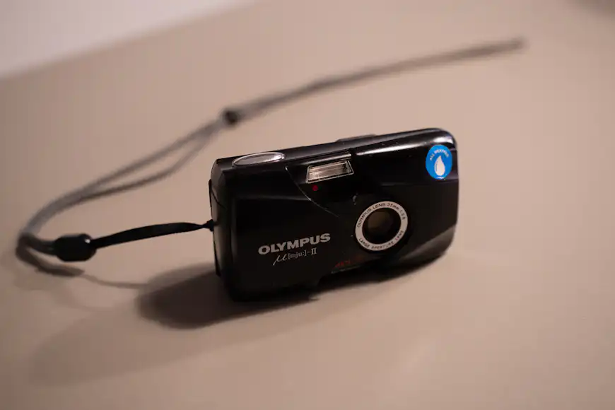 A photograph of the Olympus Mju II camera from the front.