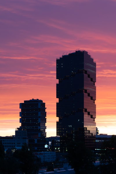 EDGE East Side Tower in Berlin by Bjarke Ingels Group in the sunset.