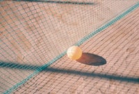 A balloon on a tennis court.