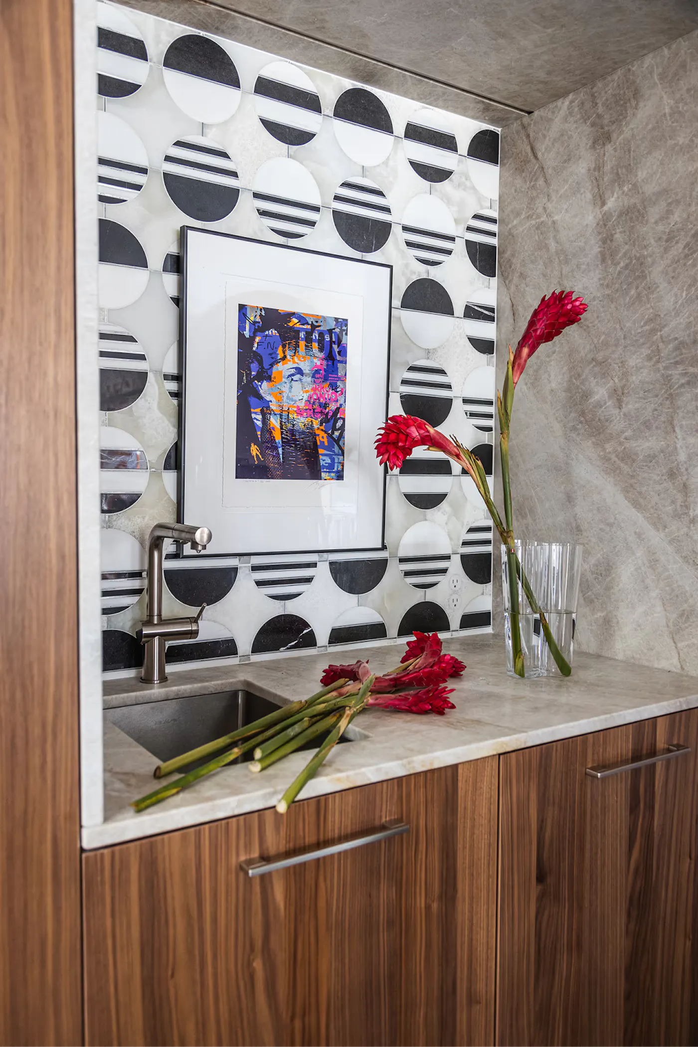 Salt Lake City interior design kitchen with patterned tile backsplash, wood cabinetry, and styled floral decor