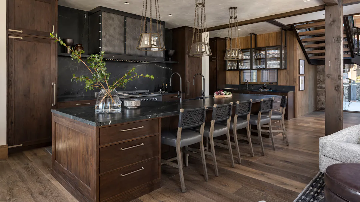 Rustic kitchen with dark wood cabinetry, black stone island, bar seating, and industrial pendant lighting