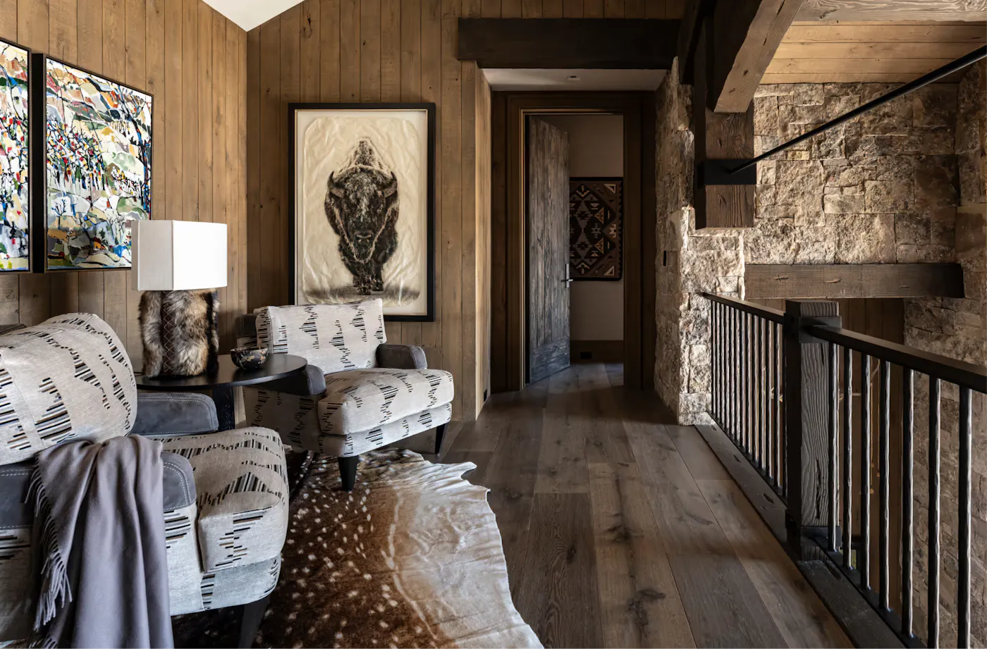 Cozy mountain modern seating nook with wood paneling and custom furnishings