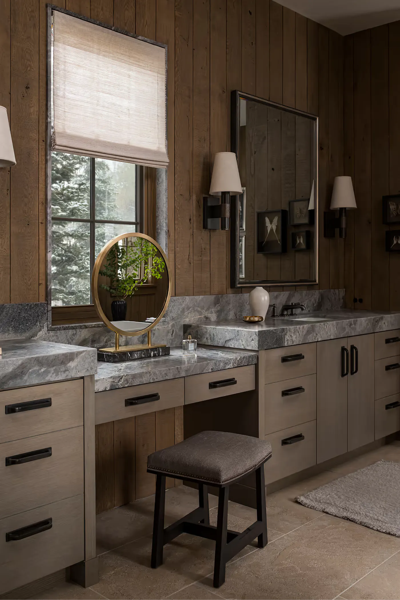 Mountain modern bathroom with custom double vanity and natural wood paneling