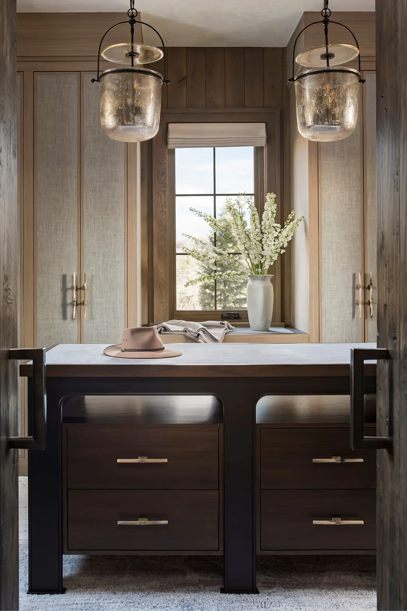 Modern rustic dressing room with custom millwork and soft natural light