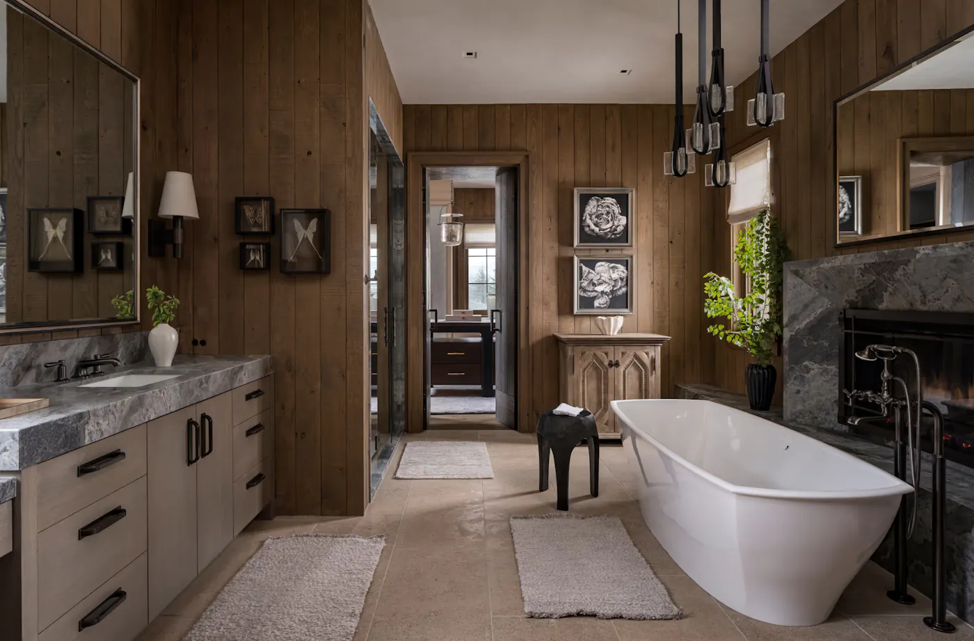 Luxury mountain modern bathroom with freestanding tub and fireplace
