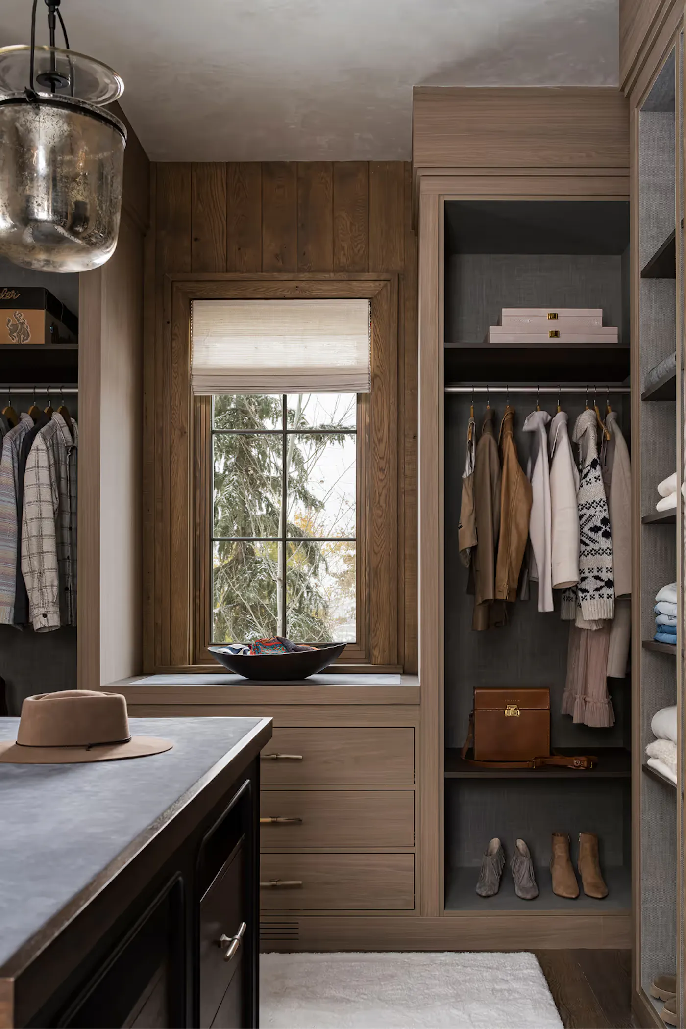 Boutique-style closet with custom millwork and styled wardrobe display