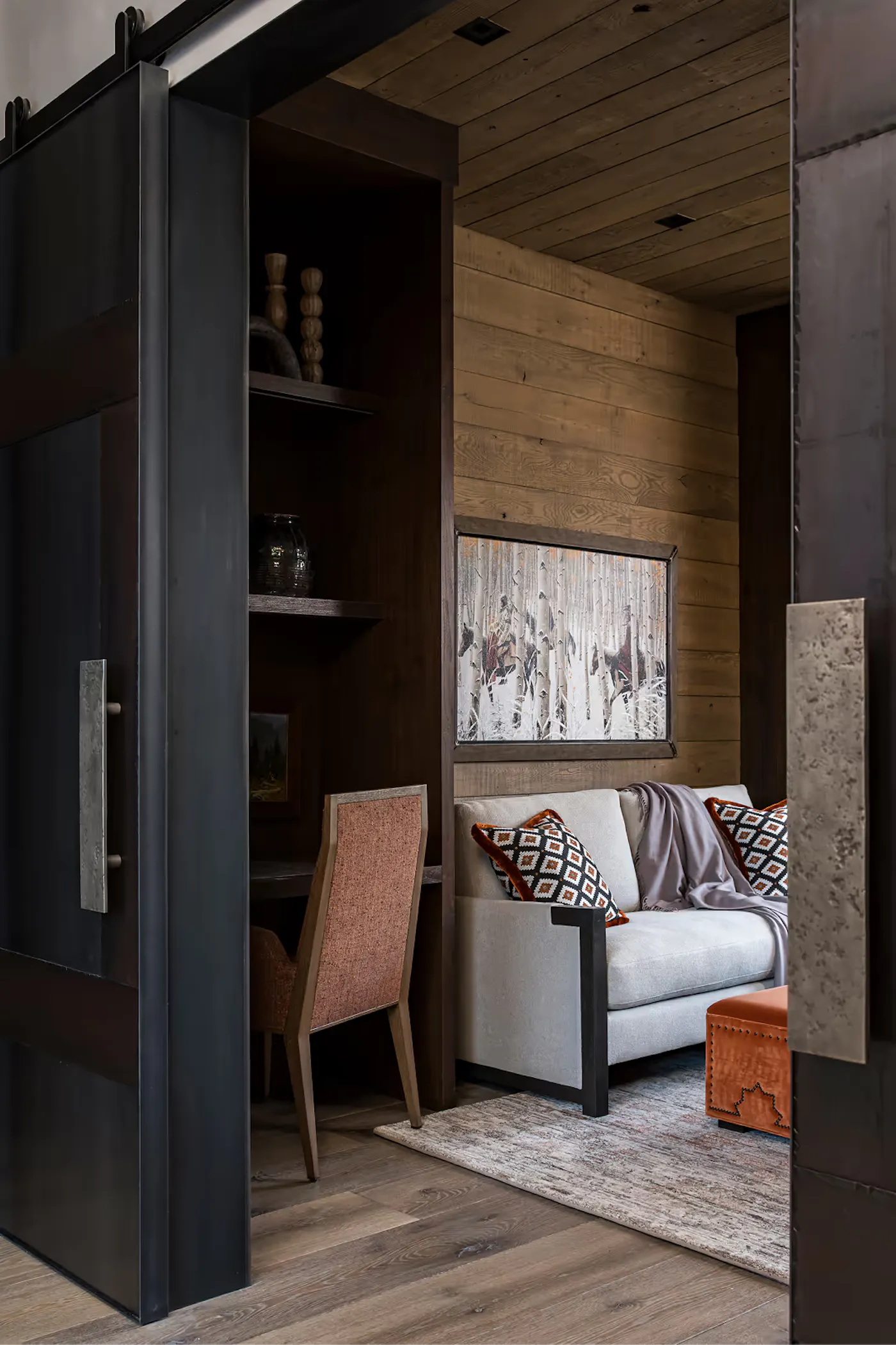 Sliding steel door with integrated millwork and custom built-in desk