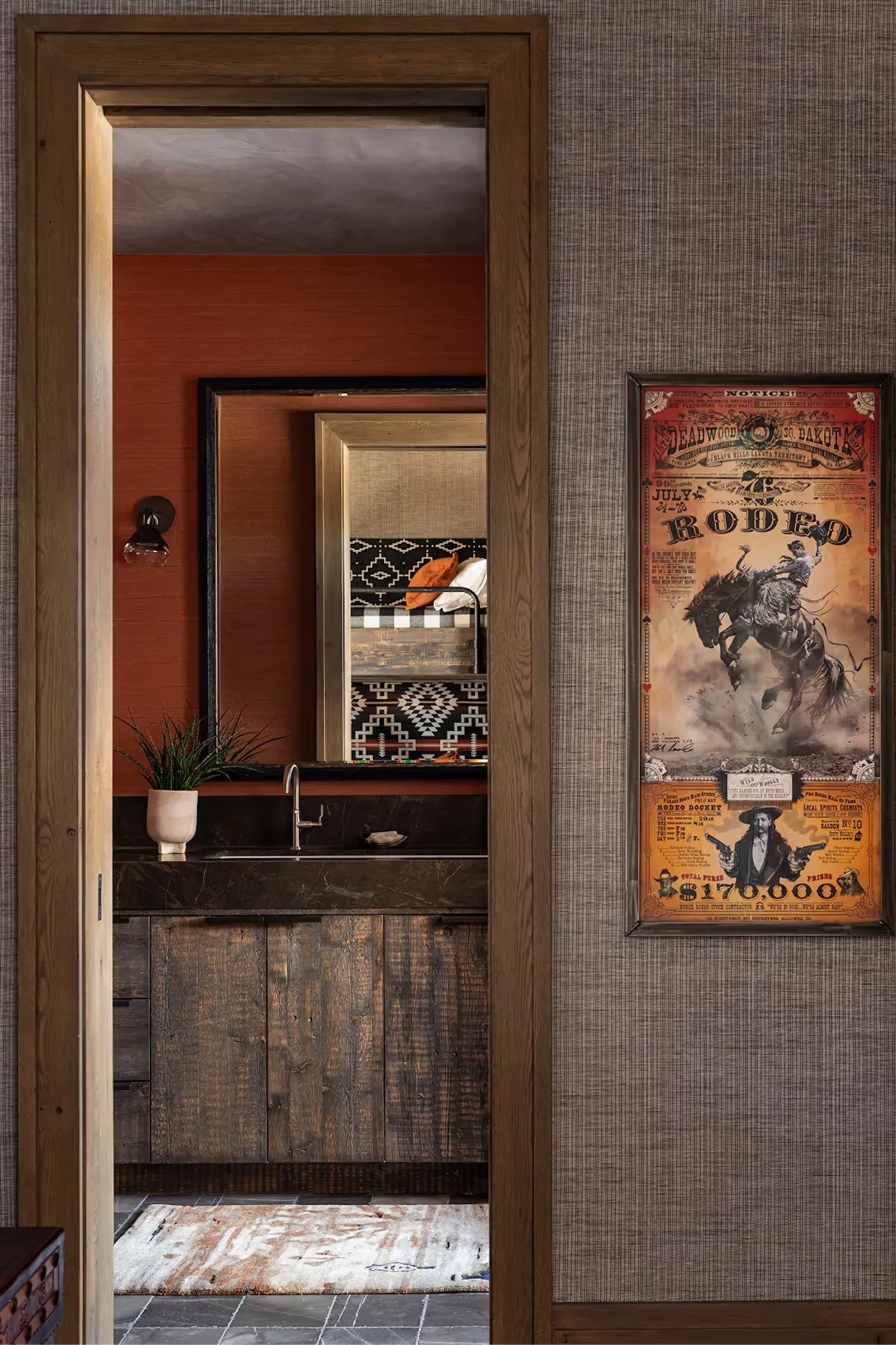 Layered interior view with framed doorway and custom millwork vignette