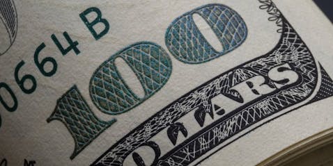 Artistic image of a close-up of a 100 dollar bill