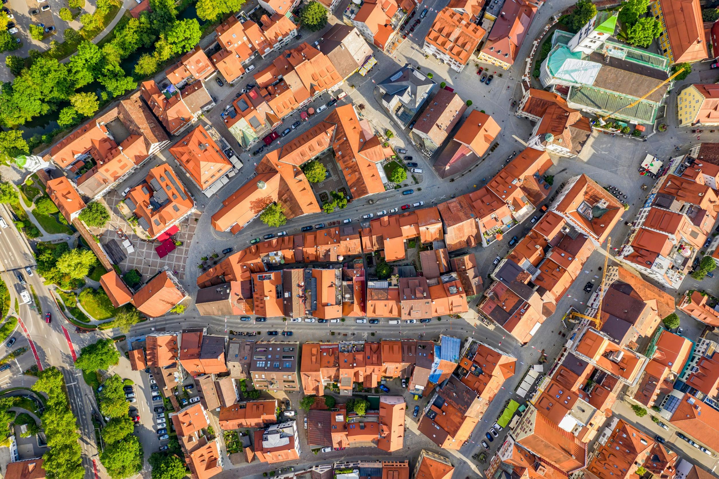 Overhead view of city business district with orange roofs