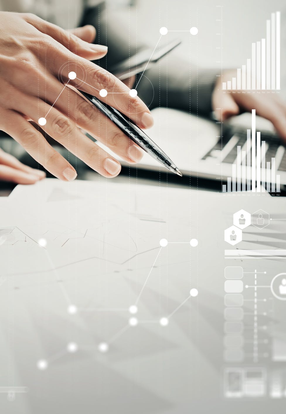 hand holding pen over papers, data icons