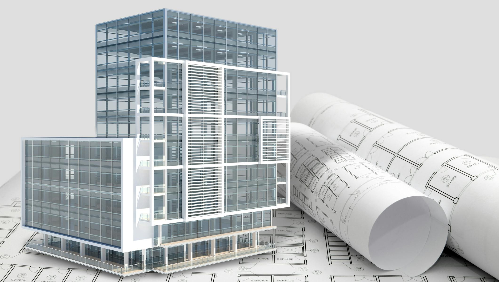 Building next to rolled up blueprints