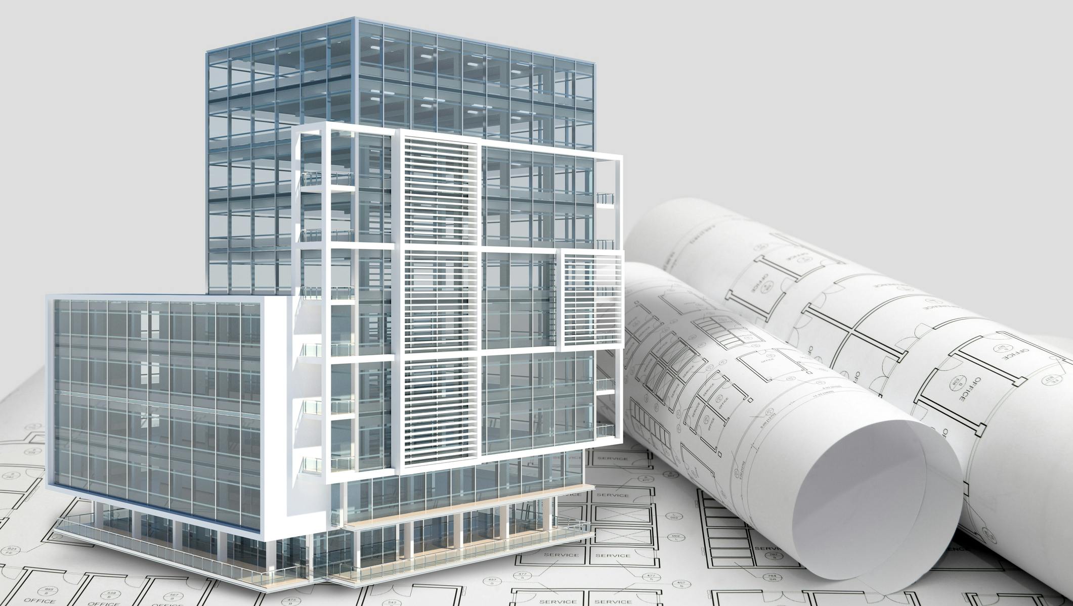 Building next to rolled up blueprints.