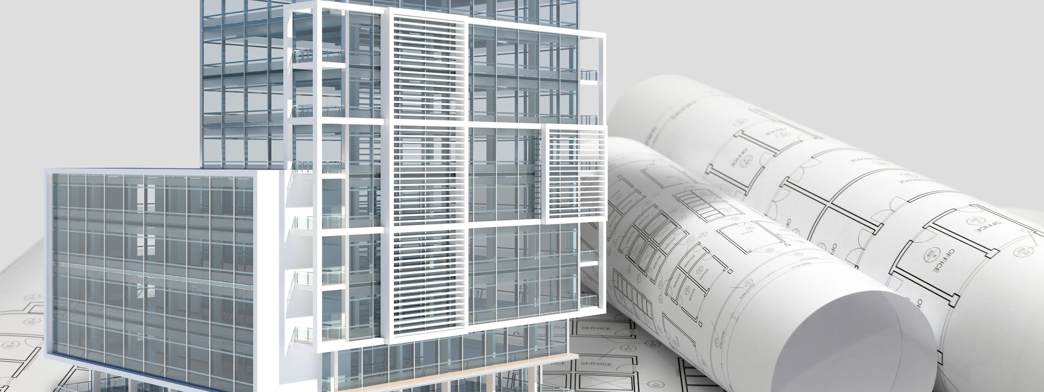 Building next to rolled up blueprints