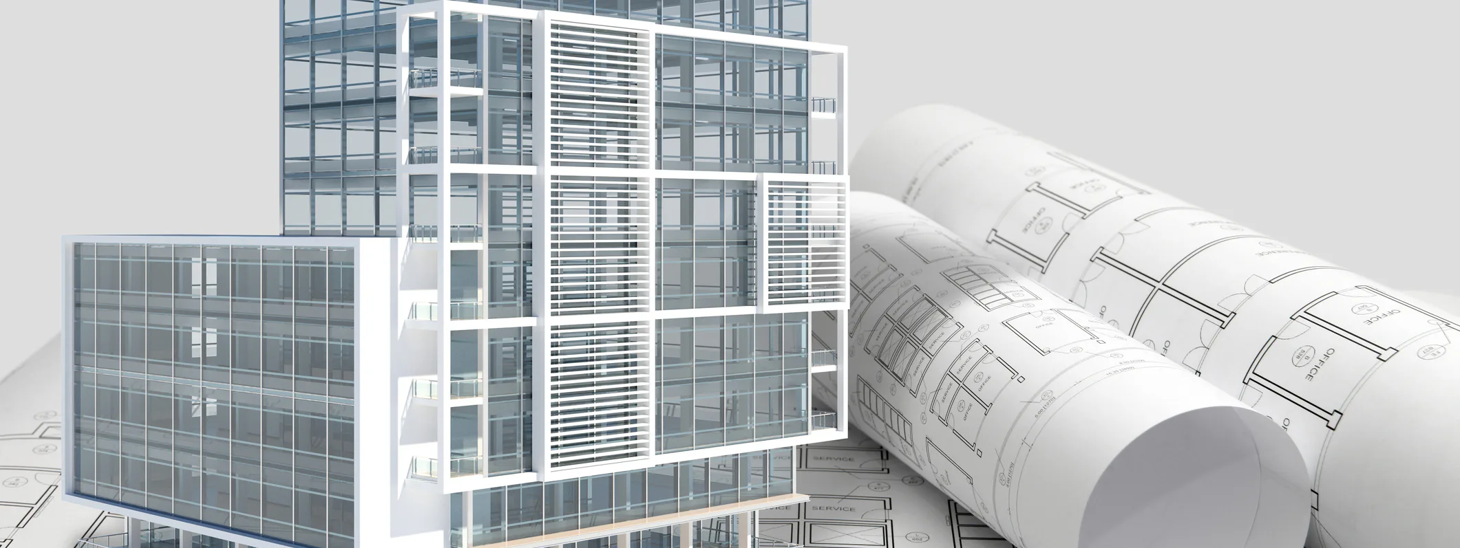 Building next to rolled up blueprints