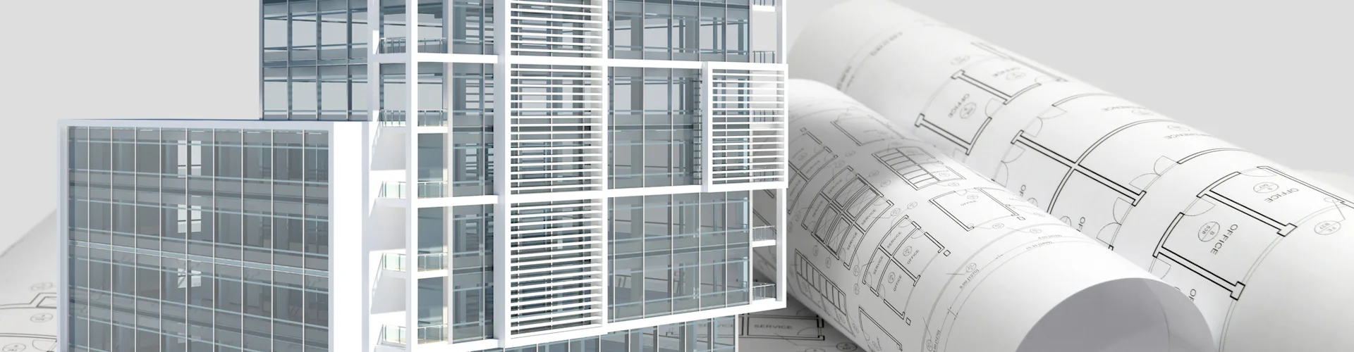 Building next to rolled up blueprints