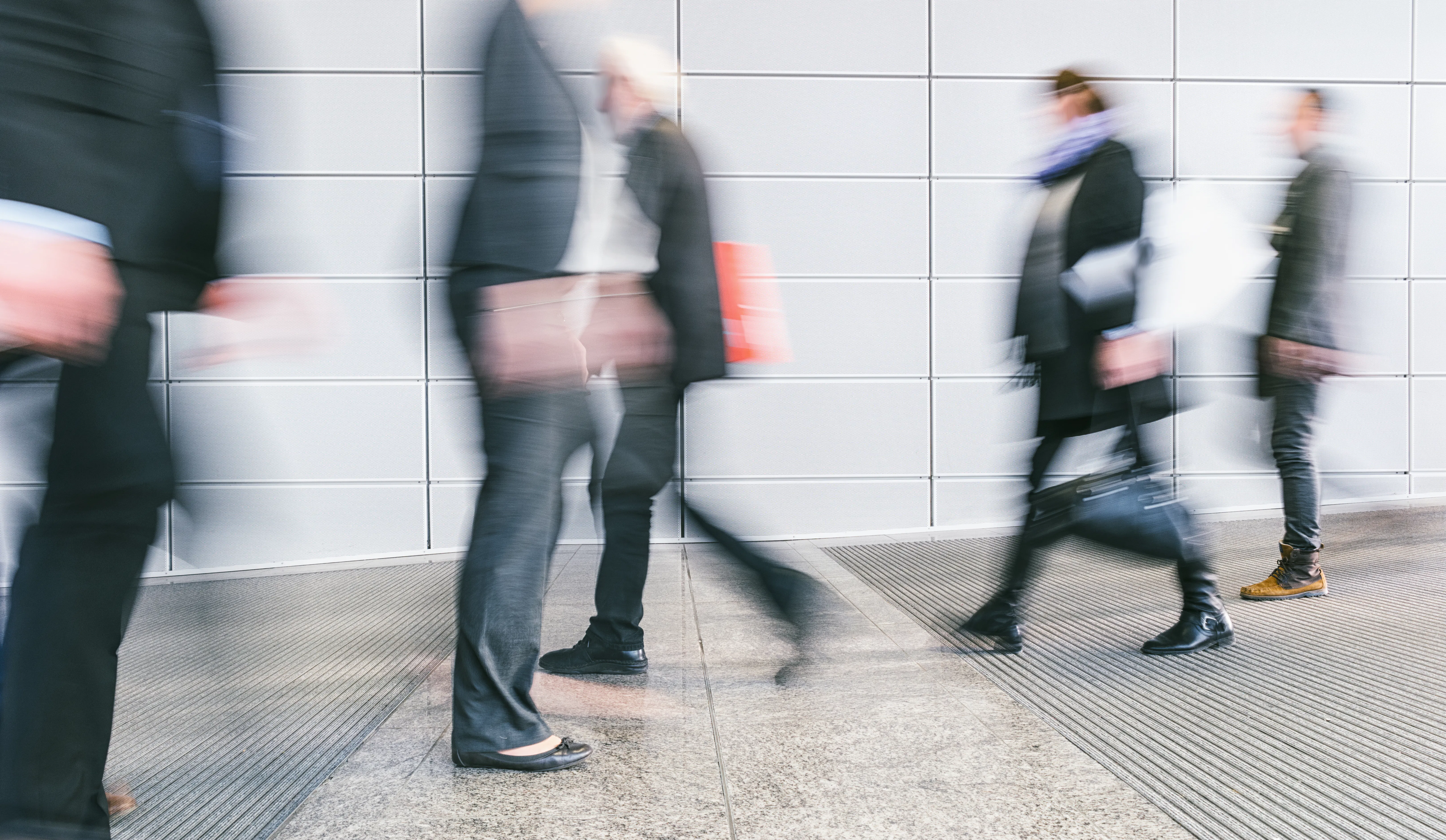people walking by, blurred