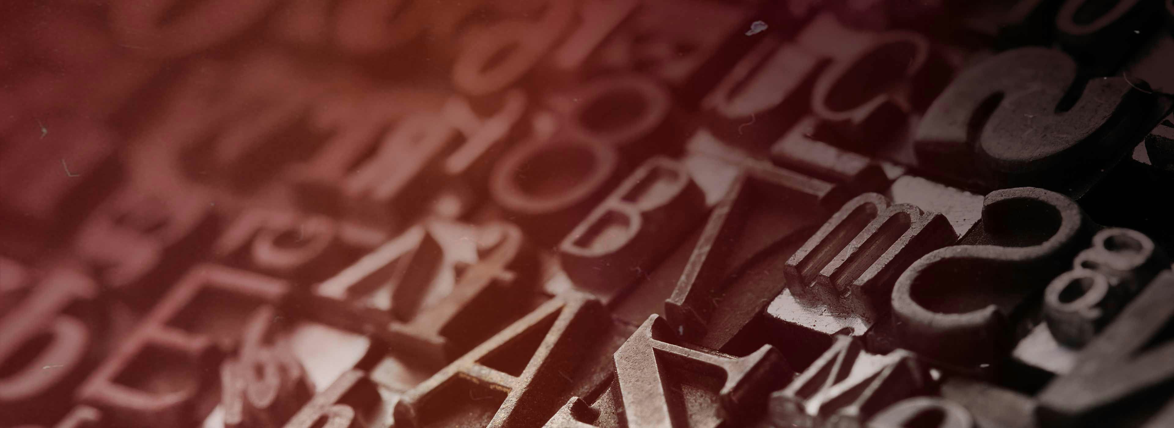 Close-up of antique printing press letters