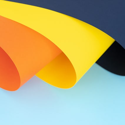 Orange, yellow and dark blue curves on light blue background
