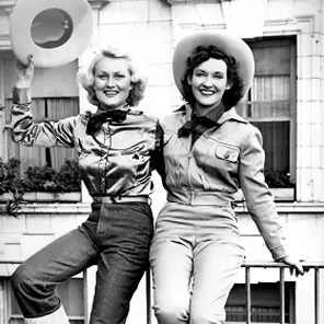 Black and white photo of two cowgirls