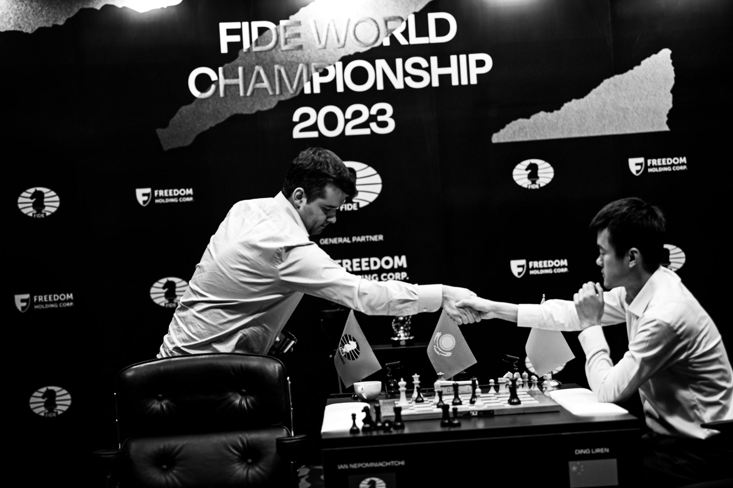 Ding embraced by his second Richard Rapport after his first ever world  championship victory : r/chess